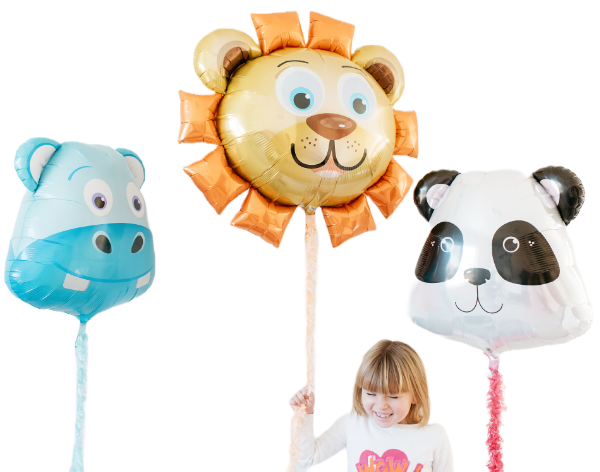 happy girl holding giant foil animal balloons